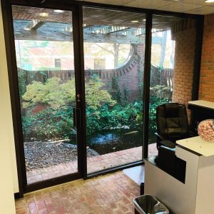 built in pond behind a glass sliding door